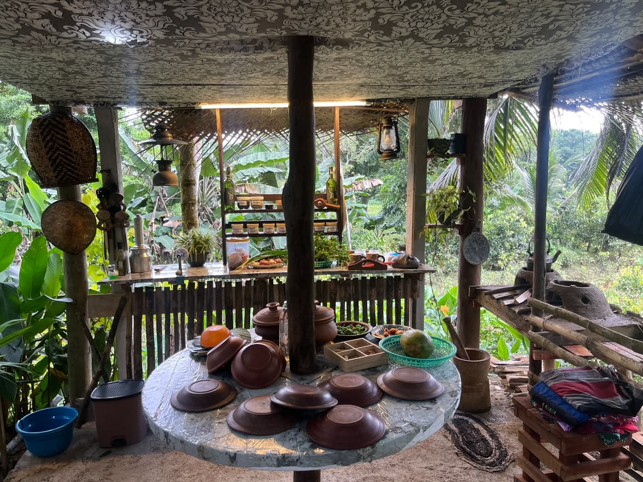 The open-air Sigma House kitchen pavilion, surrounded by tropical garden